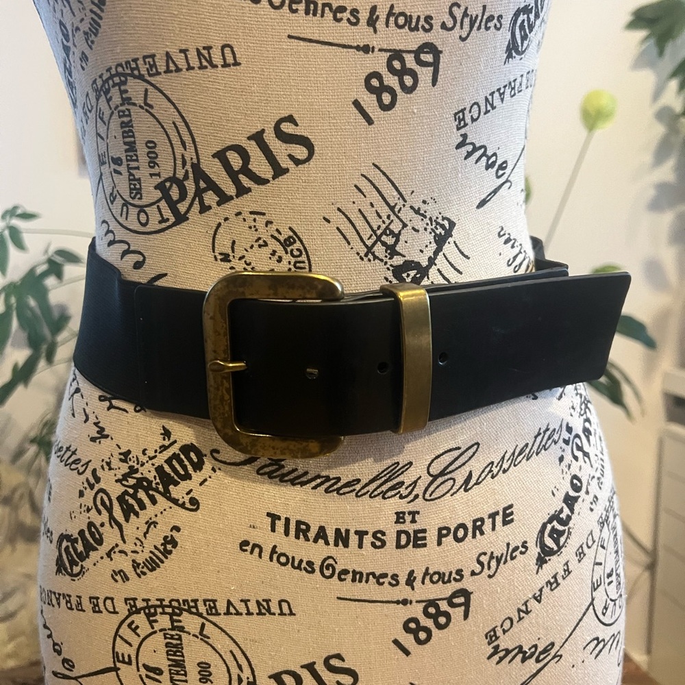 Black elastic belt with brass buckle. Size small-medium